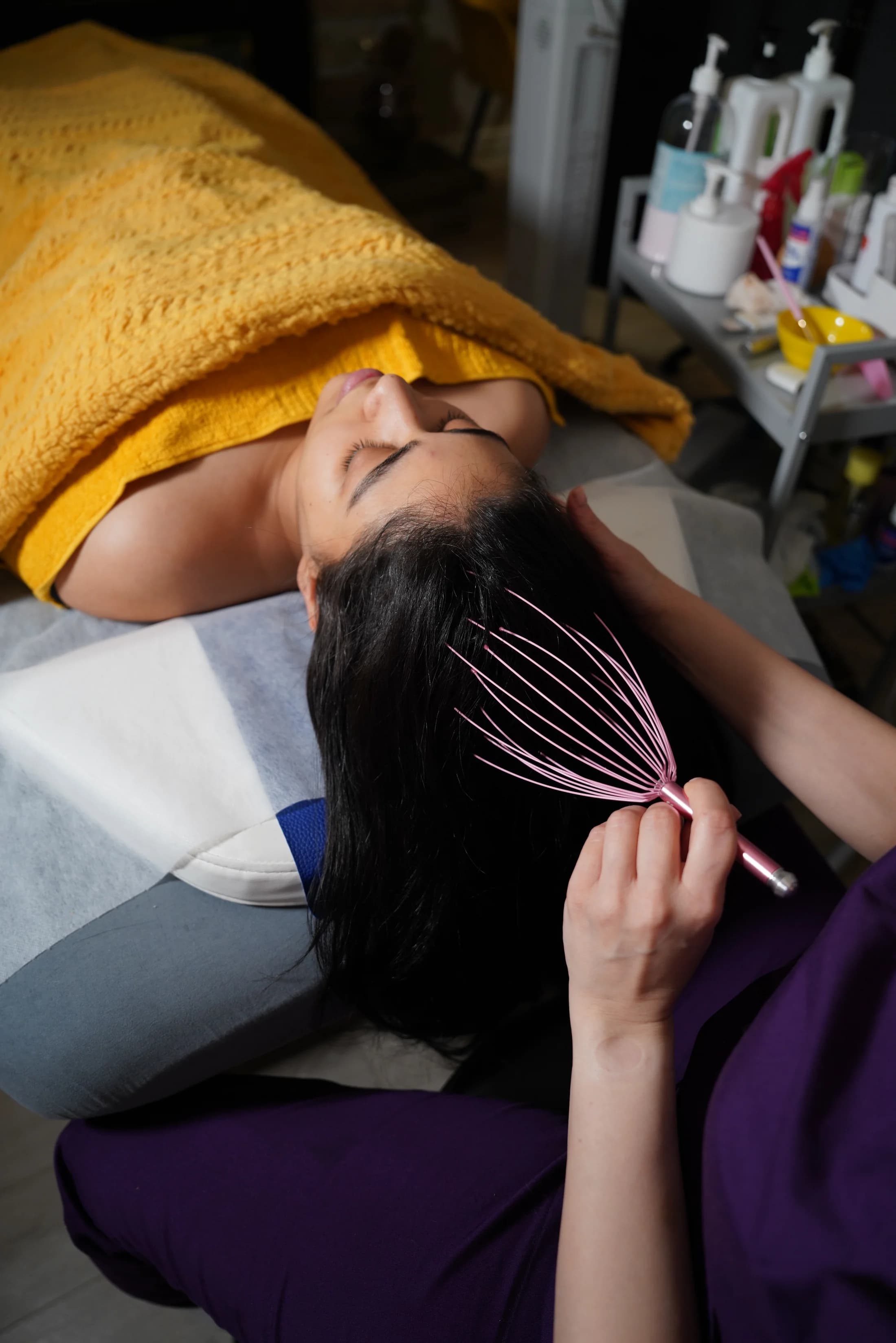 Scalp massage treatment using a specialized head massage tool